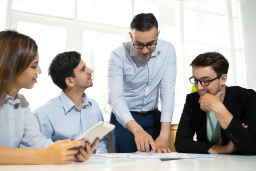 Office colleagues discussing with each others